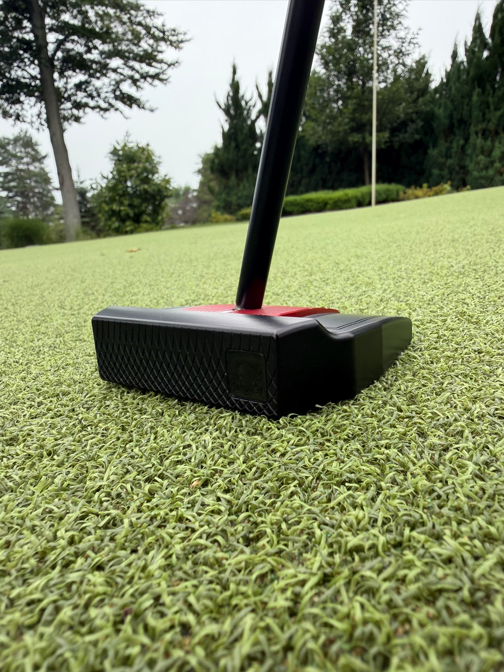 T Squared T Zero putter from behind, showing the milled body and cross hatch flank